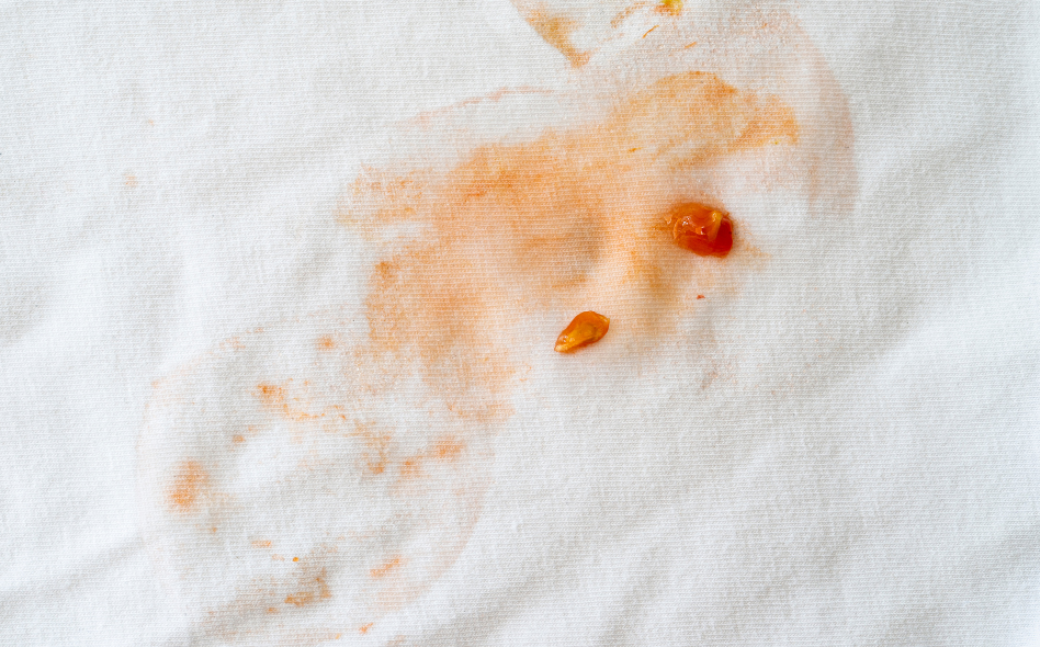 food or sauce stains on white clothes